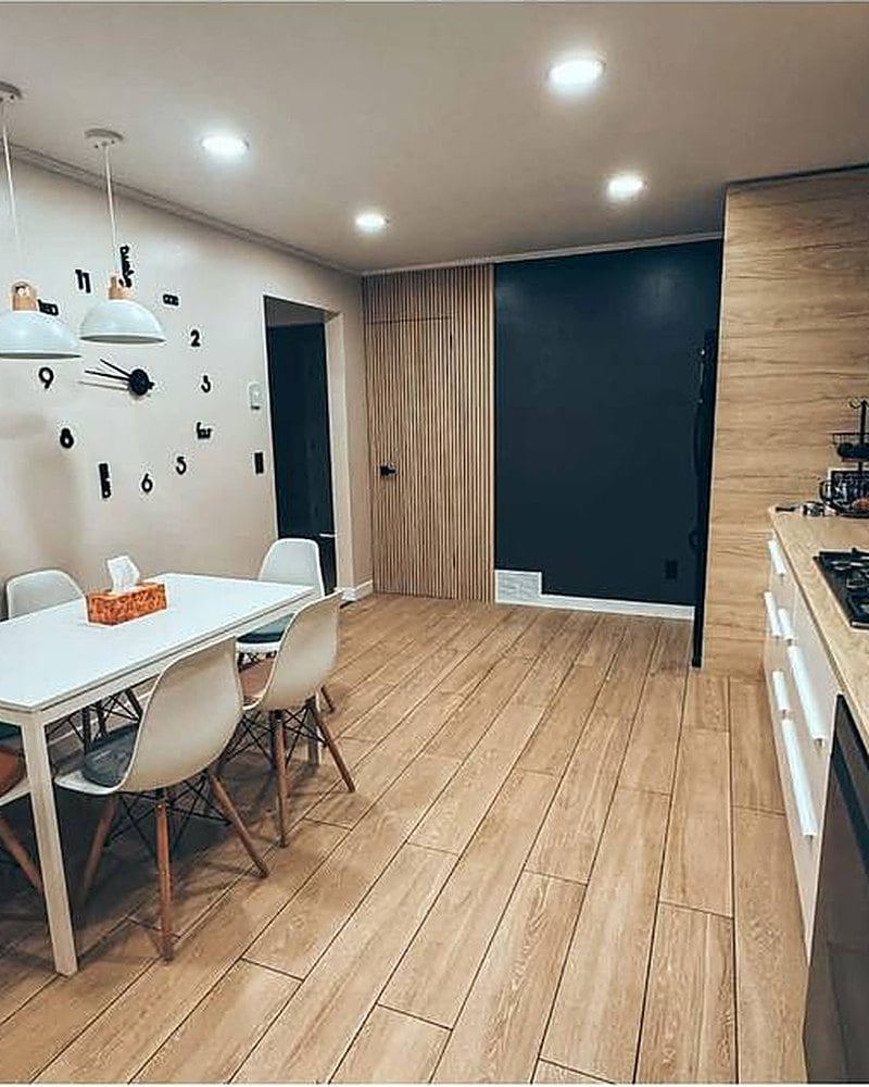 Open kitchen and dining area with oak floors